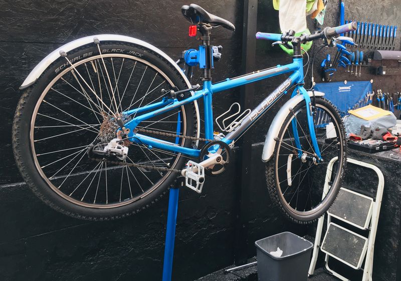 Freshly serviced bike on stand in The Bike Guy workshop